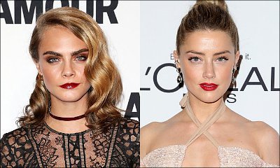 New Couple Alert? Cara Delevingne and Amber Heard Reportedly 'Locking Lips' at Party
