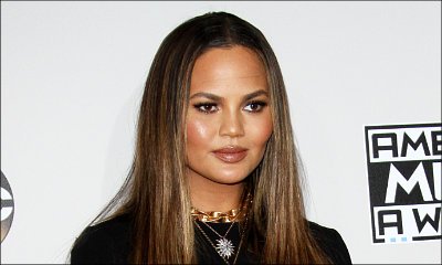 Chrissy Teigen Hilariously Responds to Fans Criticizing Her Daring AMA Dress