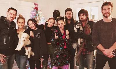 Liam Hemsworth Joins Miley Cyrus and Her Family for Early Christmas Party