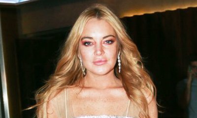 Lindsay Lohan Steps Outs Sans Hijab as She Parties With a Mystery Man in Greece