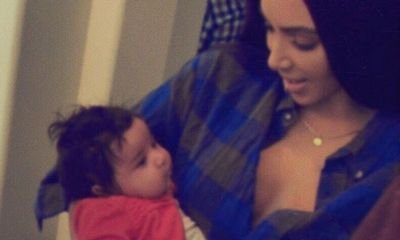 Kim Kardashian Cooing and Holding Baby Dream in New Picture