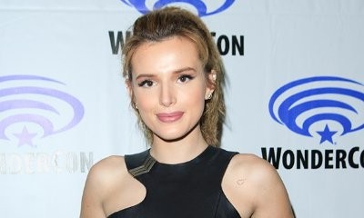 Braless Bella Thorne Flashes Nipple Piercings in Crop Top