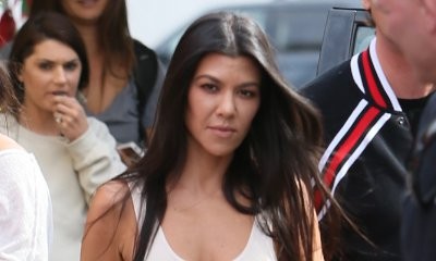 Braless Kourtney Kardashian Shows Off Her Ample Assets in Tight Tank Top