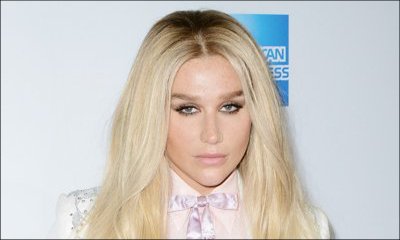 Braless Kesha Flashes Major Cleavage in Red Suit in Washington D.C.