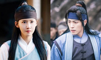 Watch a Cute Moment of Yoona and Hong Jong Hyun Sharing an Umbrella on 'King in Love' Set