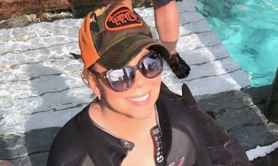 Mariah Carey's Ample Boobs Almost Spill Out of Her Plunging Wetsuit