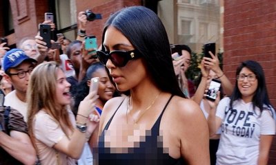 Kim Kardashian Flashes Nipples and Sideboob in White Tank Top