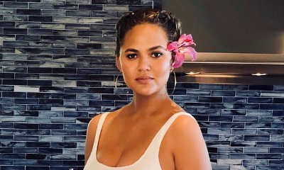 Chrissy Teigen Flaunts Growing Baby Bump in Sexy Bodysuit - See the Pics!
