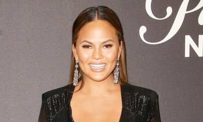 Pregnant Chrissy Teigen Grabs Her Bare Boobs as She Goes Topless - See Pics