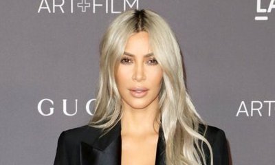 Kim Kardashian Breaks Her 'No Jewelry' Rule by Wearing Diamond Grill on IG, Puts on a Busty Display