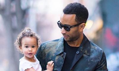 John Legend Claps Back at Hater Who Dad-Shames Him for Carrying Daughter Luna