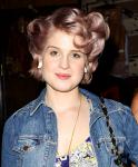 Kelly Osbourne Puts Her Diet Aside While Vacationing in U.K.