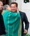 Arnold Schwarzenegger Gets a Kiss From a Priest