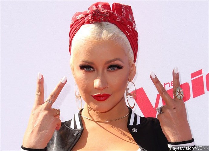 Is That a Baby Bump? Christina Aguilera Looks Pregnant When Attending Drake's Concert