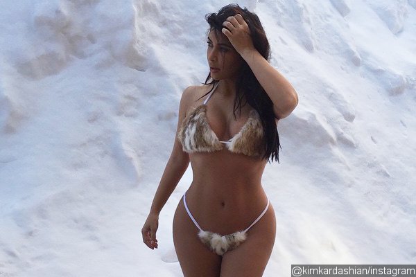 Kim Kardashian Poses in the Snow Wearing Tiny Fur Bikini