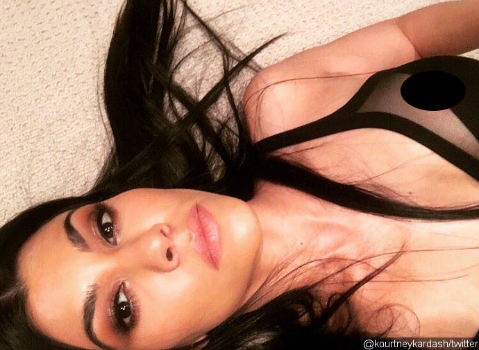 Kourtney Kardashian Has a Nip Slip While Wishing Fans Goodnight