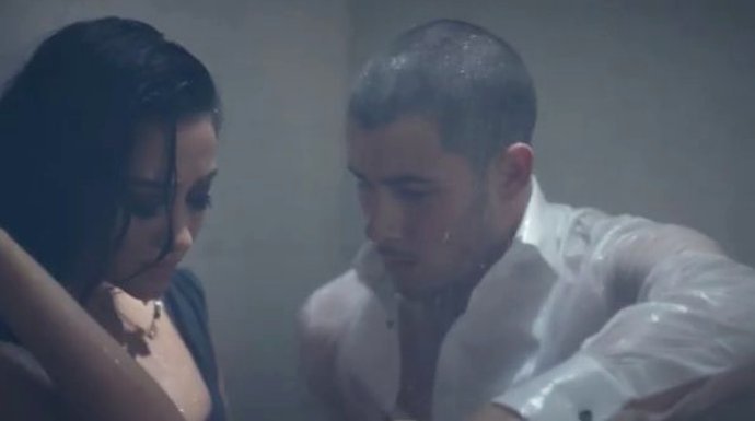 Nick Jonas Gets Real Close to Shay Mitchell in Preview for 'Under You' Music Video