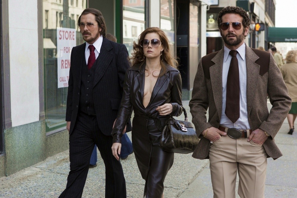 Christian Bale, Amy Adams and Bradley Cooper in Columbia Pictures' American Hustle (2013)