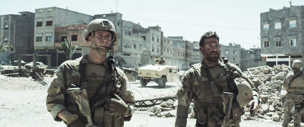 Jake McDorman stars as Ryan Job and Bradley Cooper stars as Chris Kyle in Warner Bros. Pictures' American Sniper (2014)