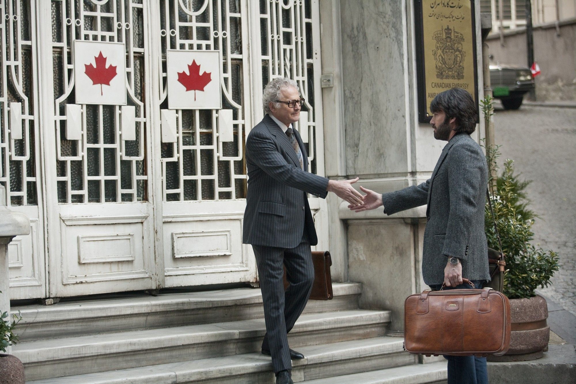Victor Garber stars as Ken Taylor and Ben Affleck stars as Tony Mendez in Warner Bros. Pictures' Argo (2012)
