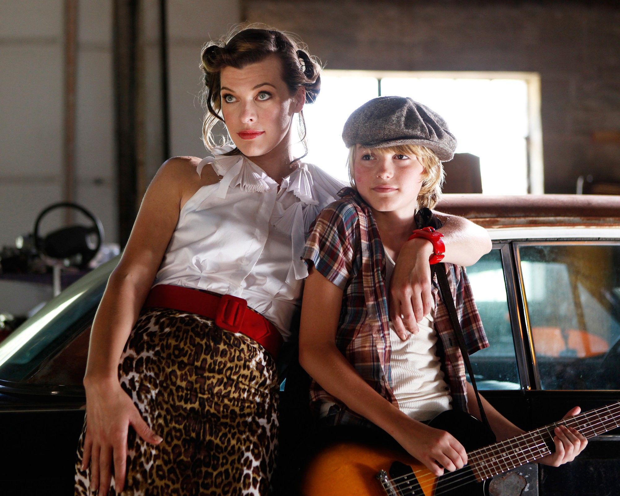 Milla Jovovich stars as Olive and Spencer List stars as Bobby in Monterey Media's Bringing Up Bobby (2012)