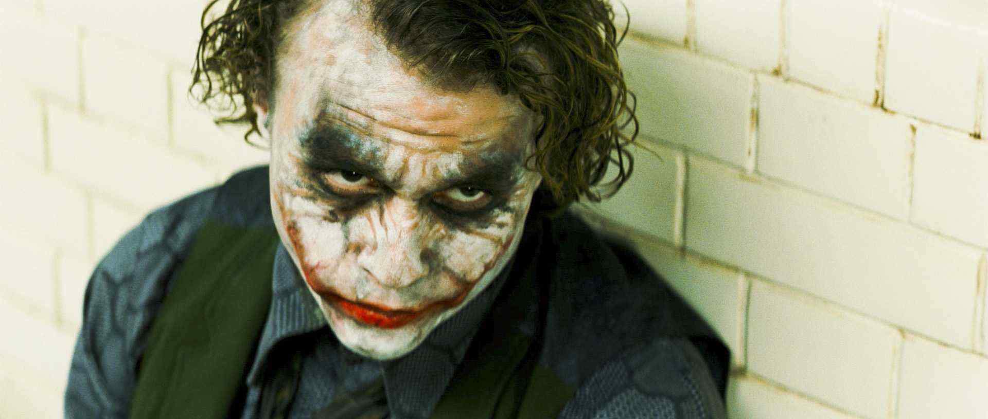 HEATH LEDGER stars as Joker in Warner Bros. Pictures' and Legendary Pictures' action drama 