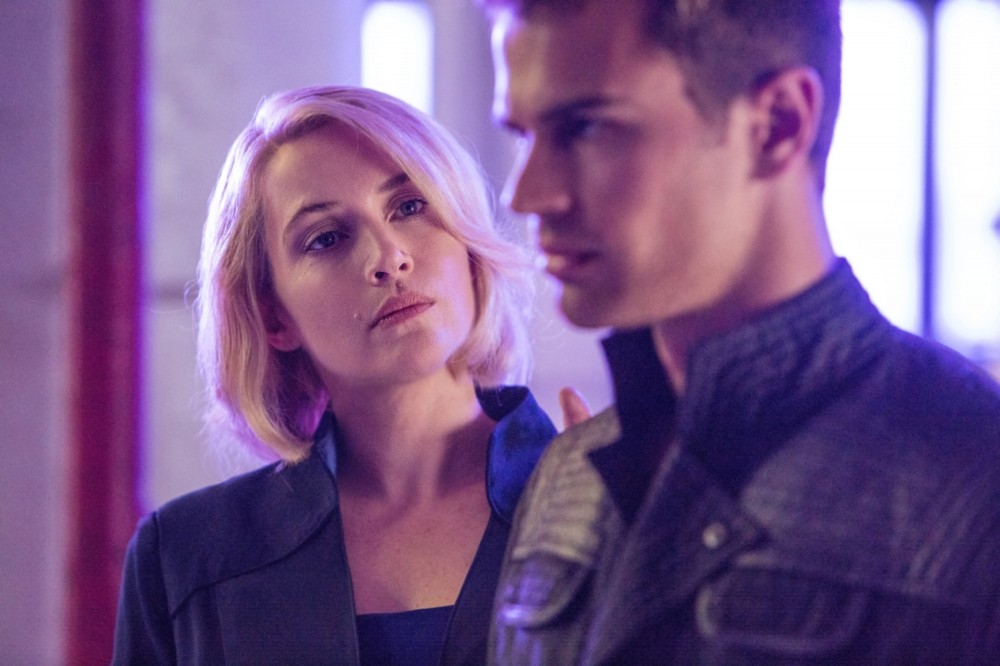 Kate Winslet stars as Jeanine Matthews and Theo James stars as Four in Summit Entertainment's Divergent (2014)