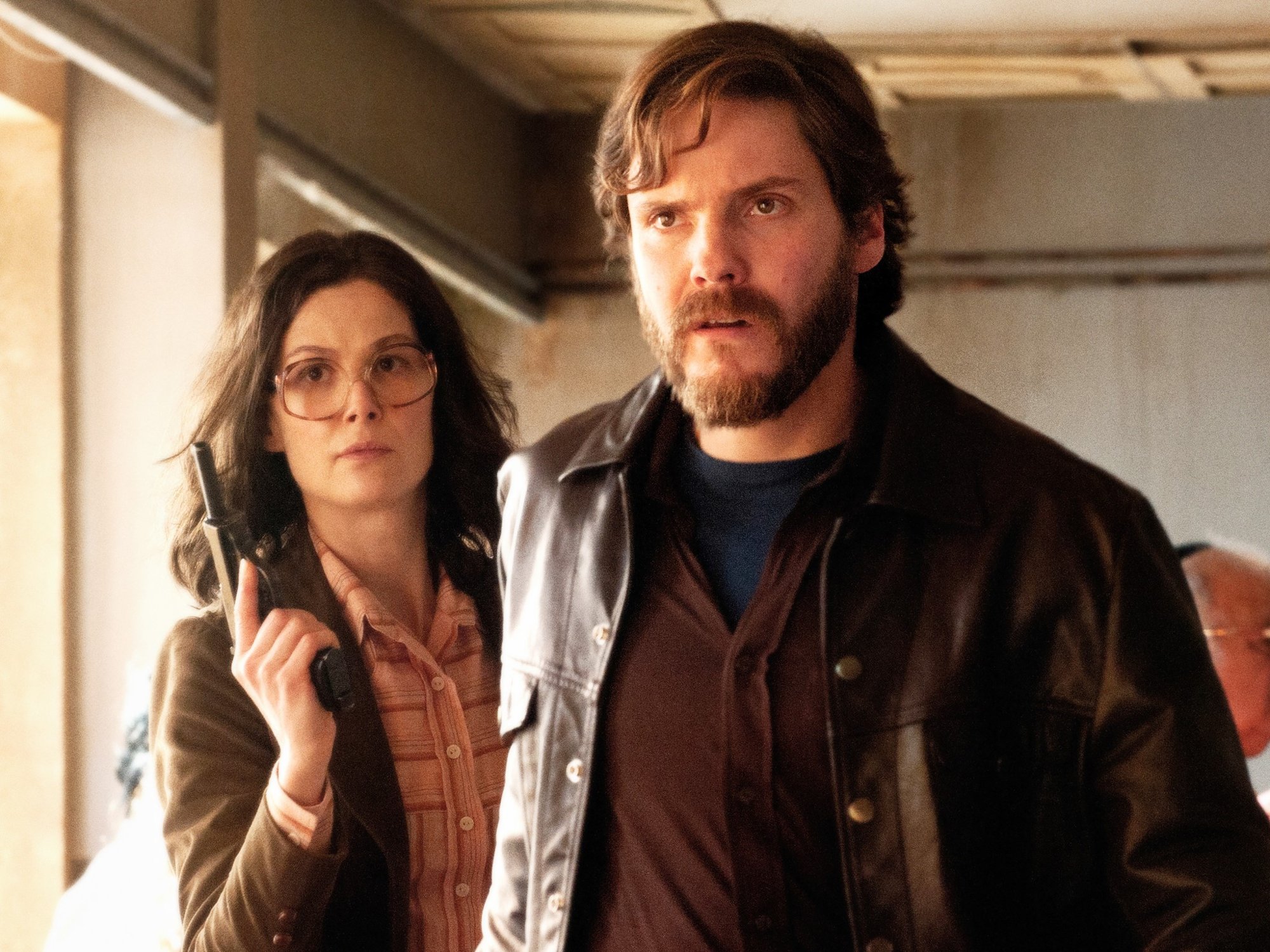 Rosamund Pike stars as Brigitte Kuhlmann and Daniel Bruhl stars as Wilfried Bose in Focus Features' 7 Days in Entebbe (2018)