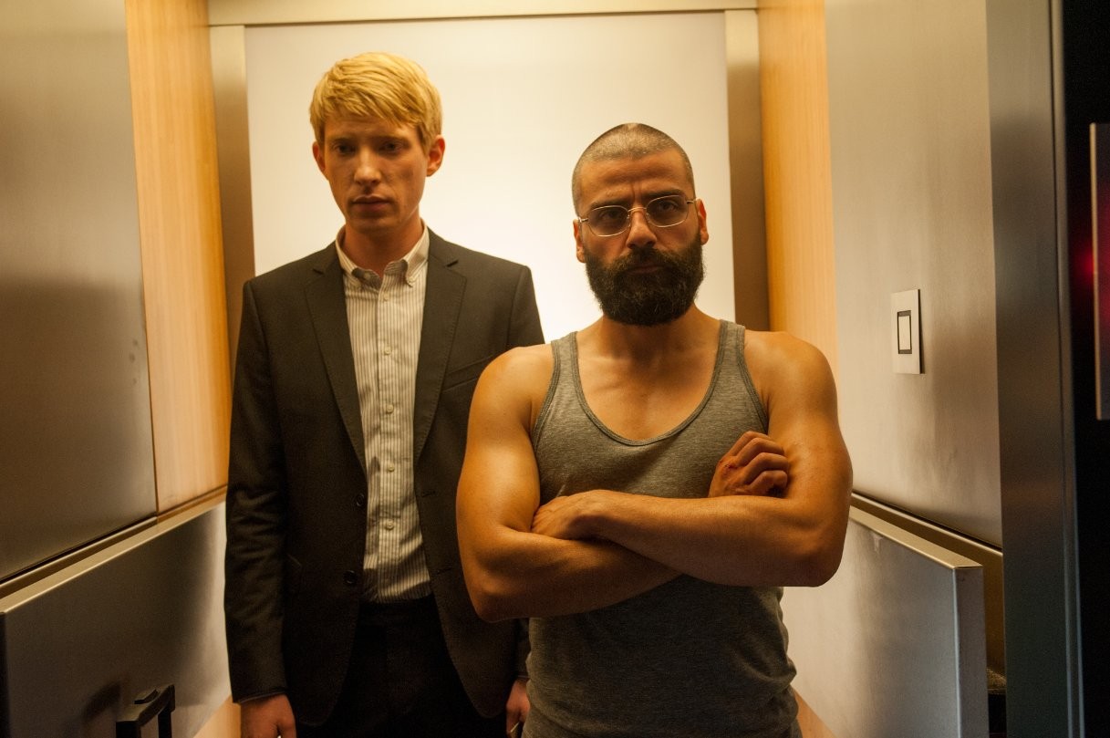 Domhnall Gleeson stars as Caleb and Oscar Isaac stars as Nathan in A24's Ex Machina (2015)