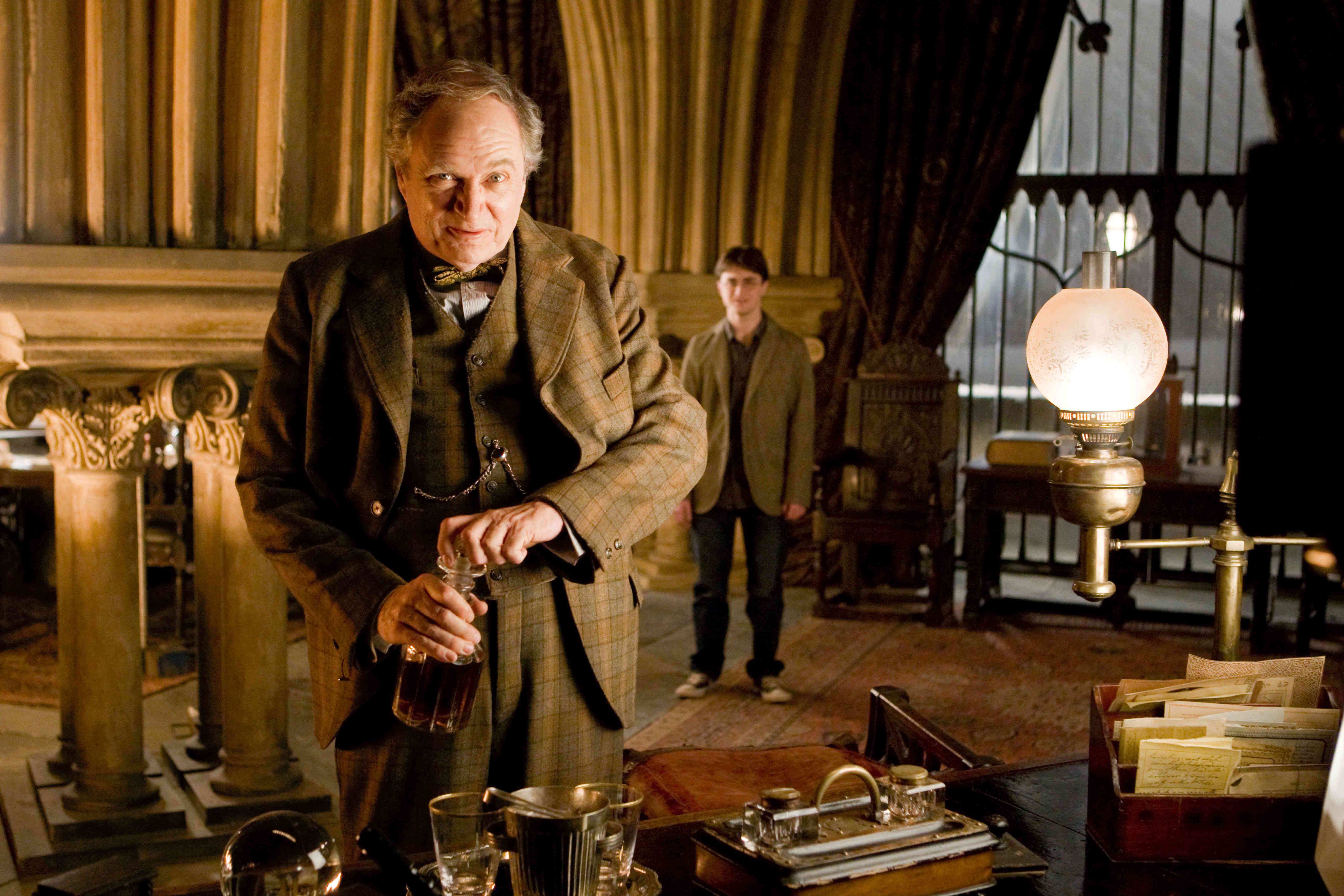 Jim Broadbent stars as Horace Slughorn and Daniel Radcliffe stars as Harry Potter in Warner Bros Pictures' Harry Potter and the Half-Blood Prince (2009)