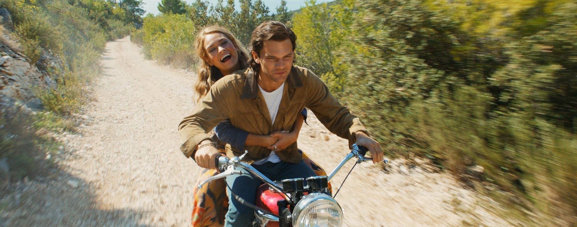 Lily James stars as Young Donna and Jeremy Irvine stars as Young Sam in Universal Pictures' Mamma Mia! Here We Go Again (2018)