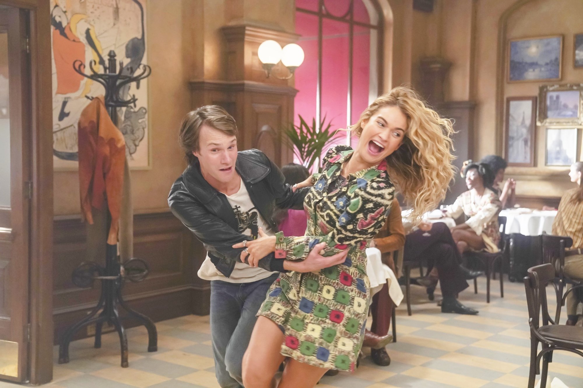 Hugh Skinner stars as Young Harry and Lily James stars as Young Donna in Universal Pictures' Mamma Mia! Here We Go Again (2018)