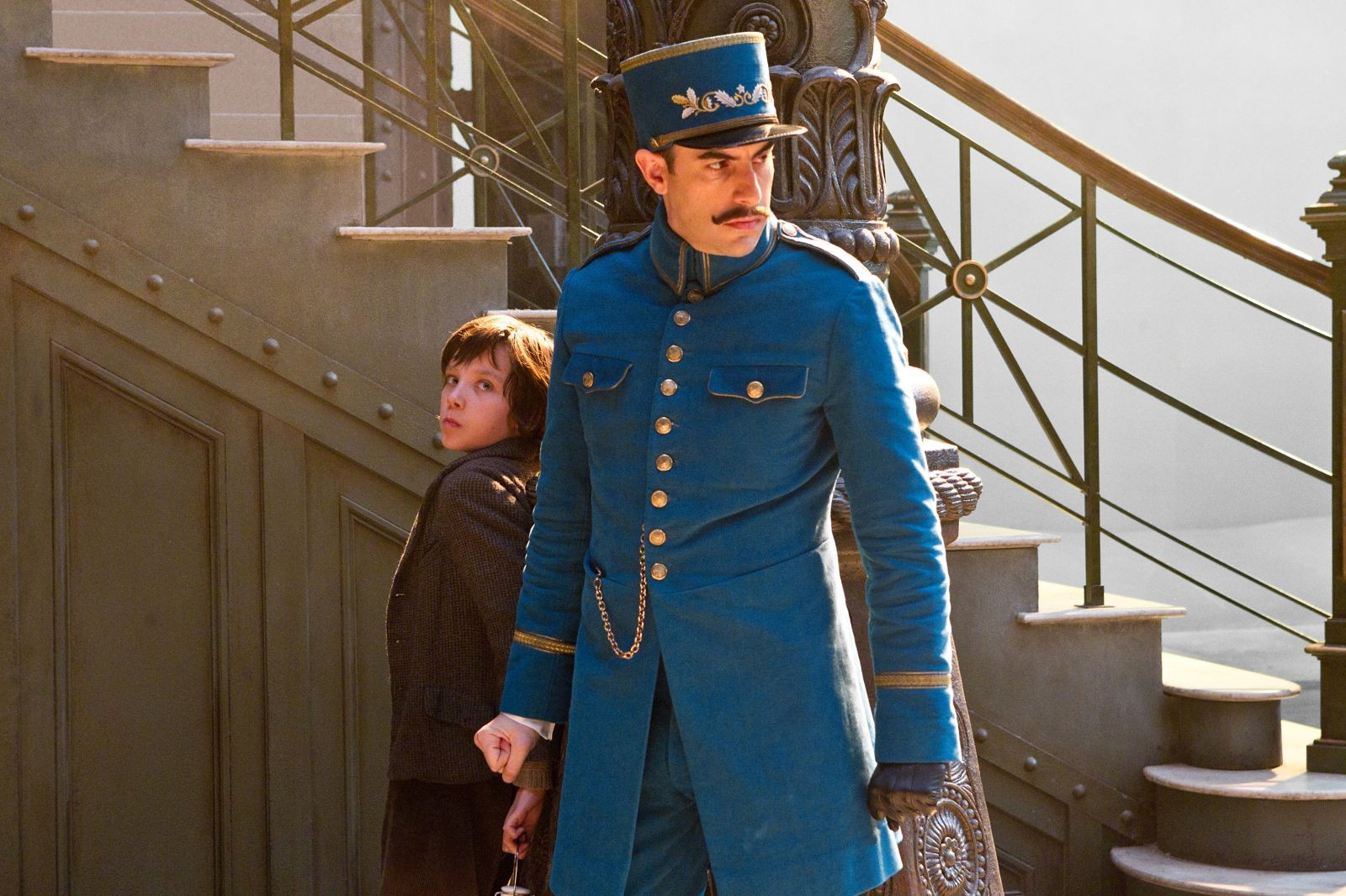 Asa Butterfield stars as Hugo Cabret and Sacha Baron Cohen stars as Station Inspector in Paramount Pictures' Hugo (2011)