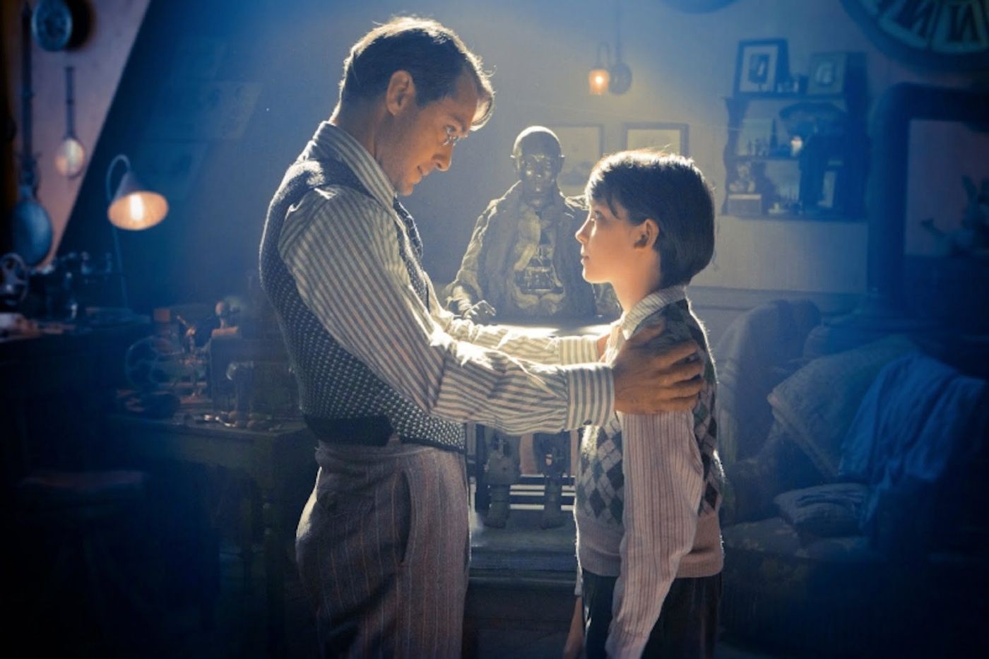 Jude Law stars as Hugo's Father and Asa Butterfield stars as Hugo Cabret in Paramount Pictures' Hugo (2011)