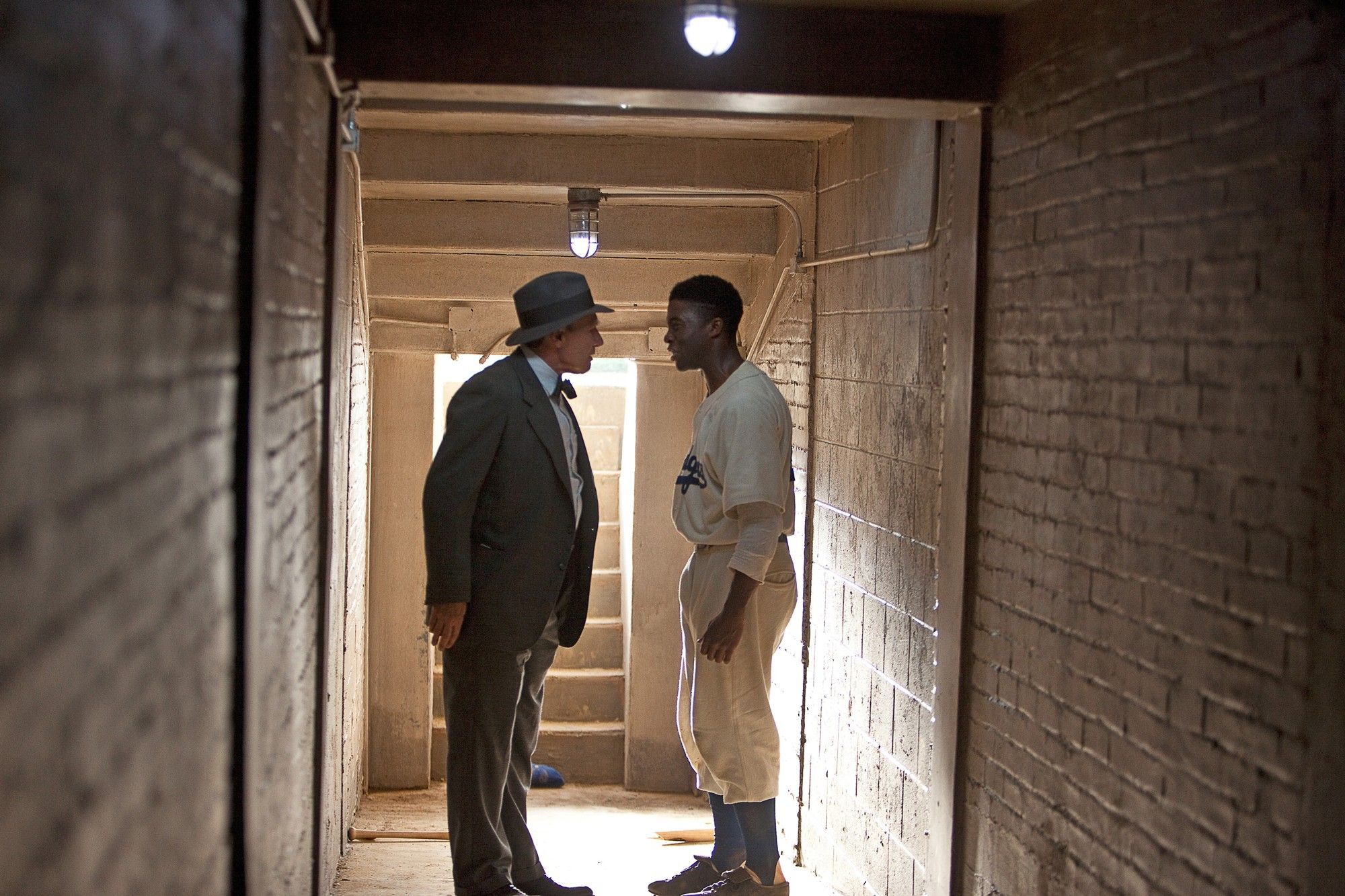 Harrison Ford stars as Branch Rickey and Chadwick Boseman stars as Jackie Robinson in Warner Bros. Pictures' 42 (2013)