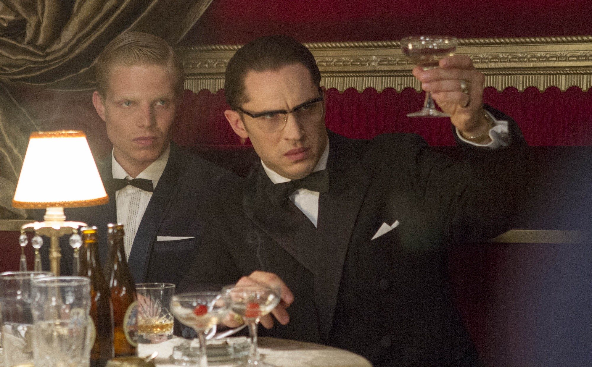 Charley Palmer Rothwell stars as Leslie Holt and Tom Hardy stars as Ronald Kray/Reginald Kray in Universal Pictures' Legend (2015)