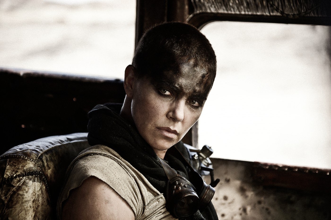 Charlize Theron stars as Imperator Furiosa in Warner Bros. Pictures' Mad Max: Fury Road (2015). Photo credit by Jasin Boland.