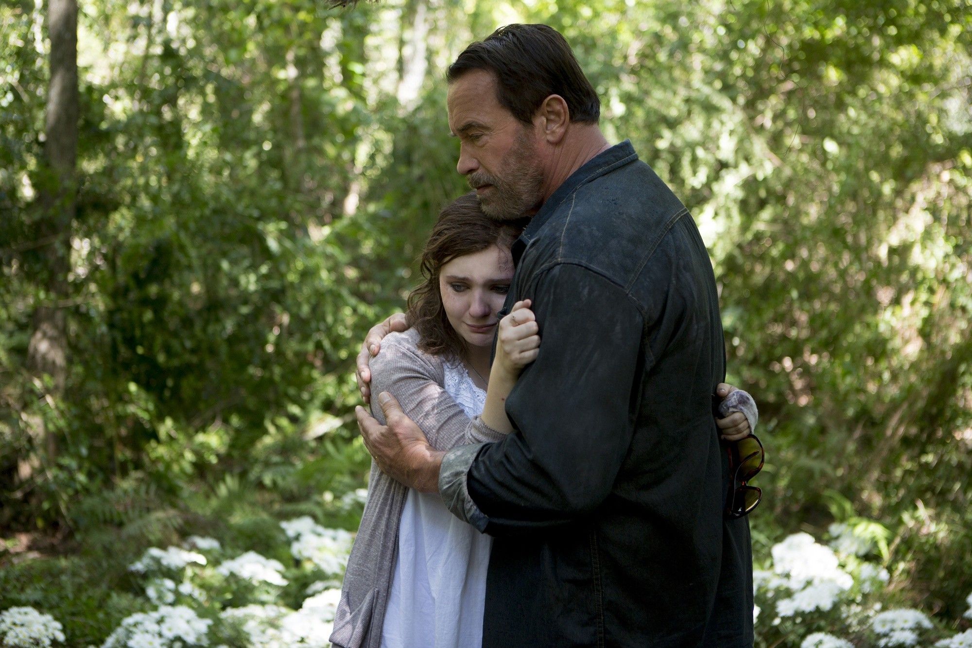 Abigail Breslin stars as Maggie and Arnold Schwarzenegger stars as Wade in Lionsgate Films' Maggie (2015)