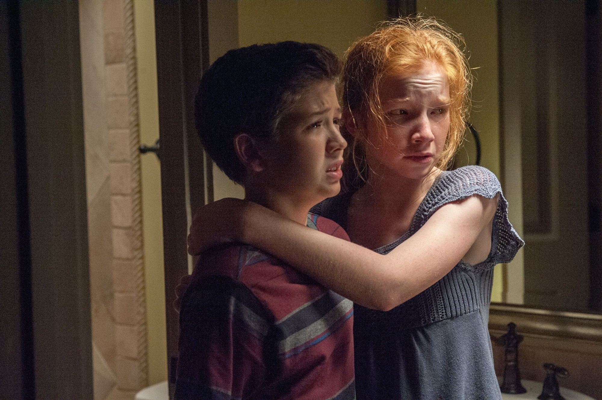 Garrett Ryan stars as Young Tim Russell and Annalise Basso stars as Young Kaylie Russell in Relativity Media's Oculus (2014)