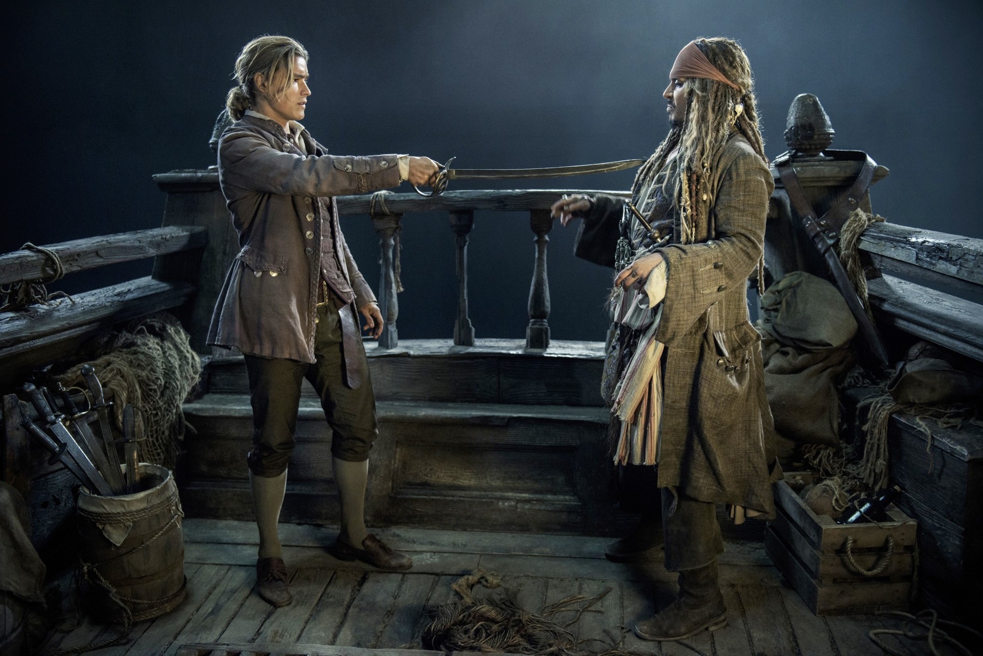 Brenton Thwaites stars as Henry Turner and Johnny Depp stars as Captain Jack Sparrow in Walt Disney Pictures' Pirates of the Caribbean: Dead Men Tell No Tales (2017)