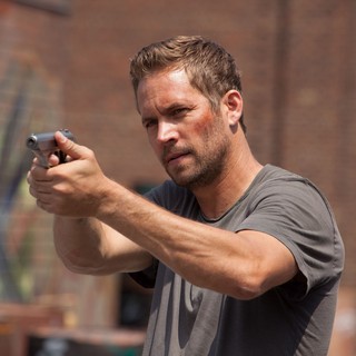 Paul Walker stars as Damien in Relativity Media's Brick Mansions (2014)