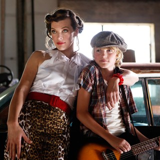 Milla Jovovich stars as Olive and Spencer List stars as Bobby in Monterey Media's Bringing Up Bobby (2012)