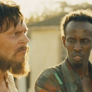 Evan Peters stars as Jay Bahadur and Barkhad Abdi stars as Abdi in Echo Bridge's The Pirates of Somalia (2017)