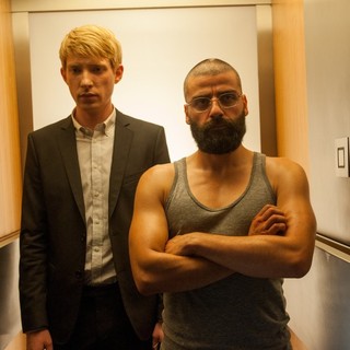 Domhnall Gleeson stars as Caleb and Oscar Isaac stars as Nathan in A24's Ex Machina (2015)
