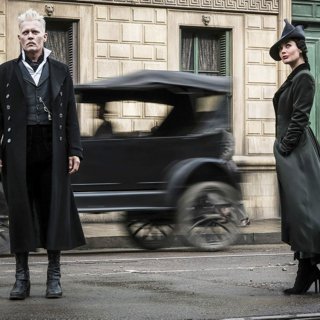 Johnny Depp stars as Gellert Grindelwald and Poppy Corby-Tuech stars as Rosier in Warner Bros. Pictures' Fantastic Beasts: The Crimes of Grindelwald (2018)