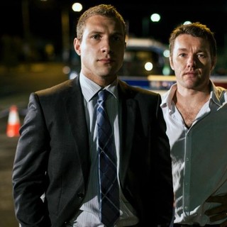 Jai Courtney stars as Jim Melic and Joel Edgerton stars as Malcolm Toohey in Gravitas Ventures' Felony (2014)