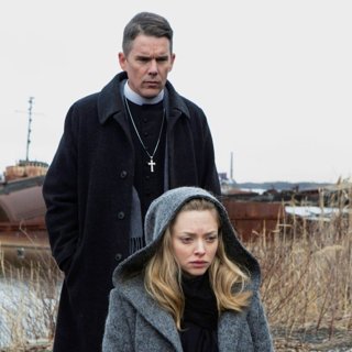Ethan Hawke stars as Toller and Amanda Seyfried stars as Mary in A24's First Reformed (2018)