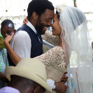 Chiwetel Ejiofor stars as Odenigbo and Thandie Newton stars as Olanna in Monterey Media's Half of a Yellow Sun (2014)