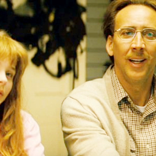 Chloe Moretz stars as Hit Girl/Mindy Macready and Nicolas Cage stars as Damon Macready in Lionsgate Films' Kick-Ass (2010)