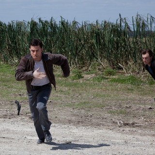 Joseph Gordon-Levitt stars as Joe and Noah Segan stars as Kid Blue in TriStar Pictures' Looper (2012)